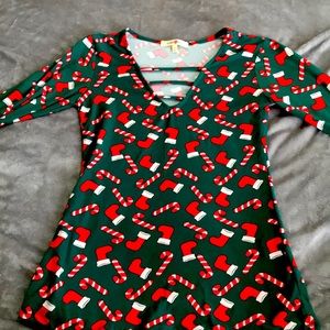 Long sleeve shirt with candy canes and stockings